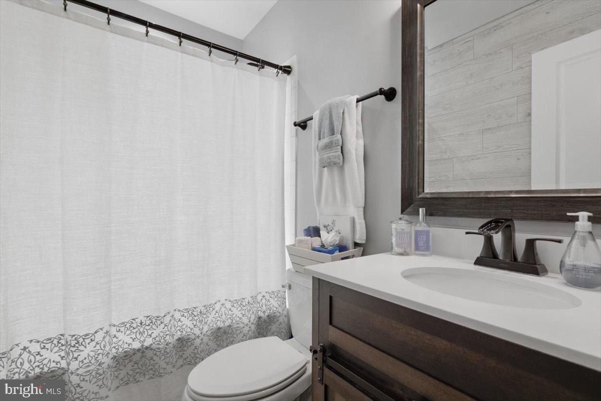 217 Morlyn Drive Stephenson, VA 22656 - Photo 19 of 35 a bathroom with a sink a toilet and shower