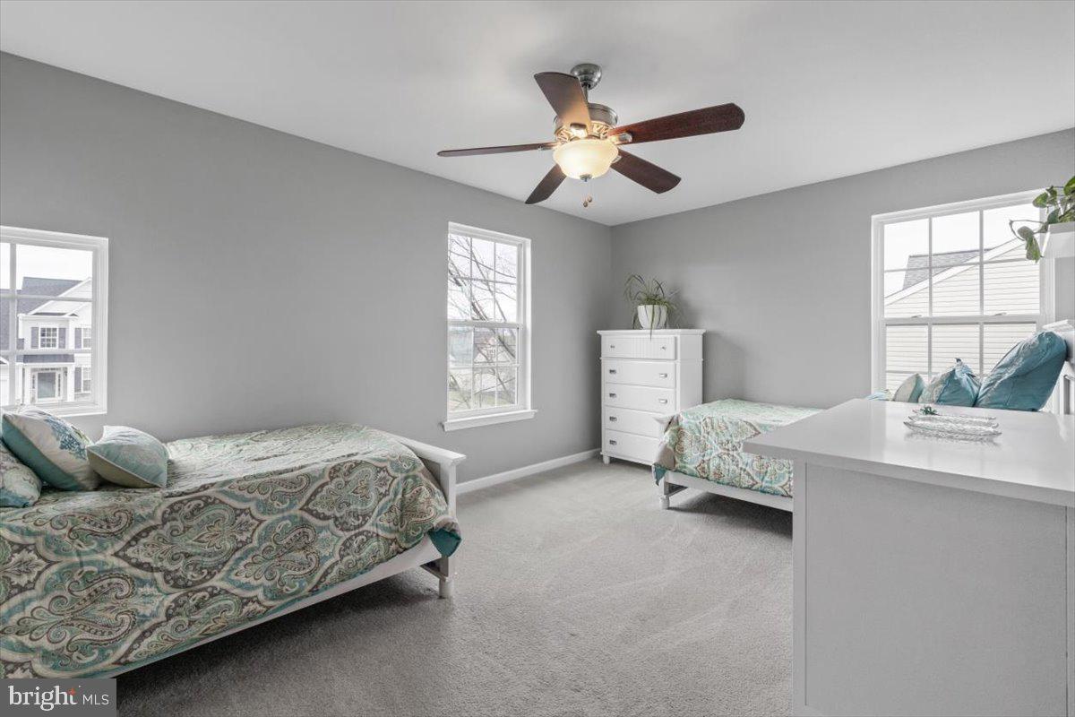 217 Morlyn Drive Stephenson, VA 22656 - Photo 21 of 35 a bedroom with a bed and a chandelier