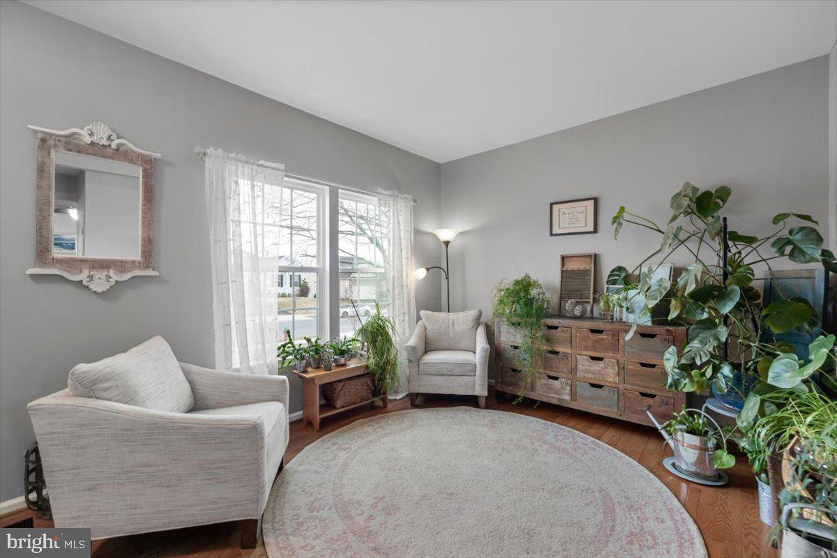 217 Morlyn Drive Stephenson, VA 22656 - Photo 3 of 35 a living room with furniture and a potted plant