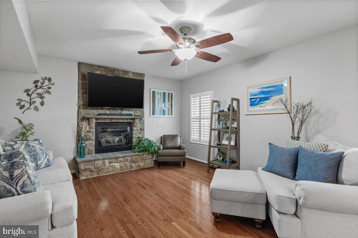 217 Morlyn Drive Stephenson, VA 22656 - Photo 5 of 35 a living room with furniture a flat screen tv and a fireplace