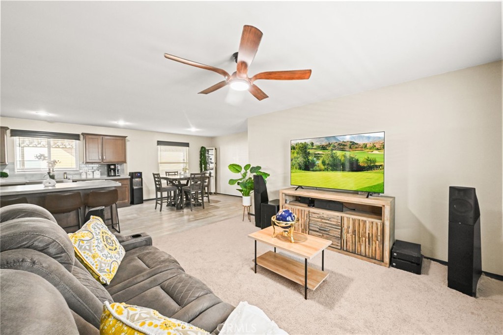 16860 Slover Avenue, Unit 70 Fontana, CA 92337 - Photo 19 of 38 a living room with furniture and a flat screen tv