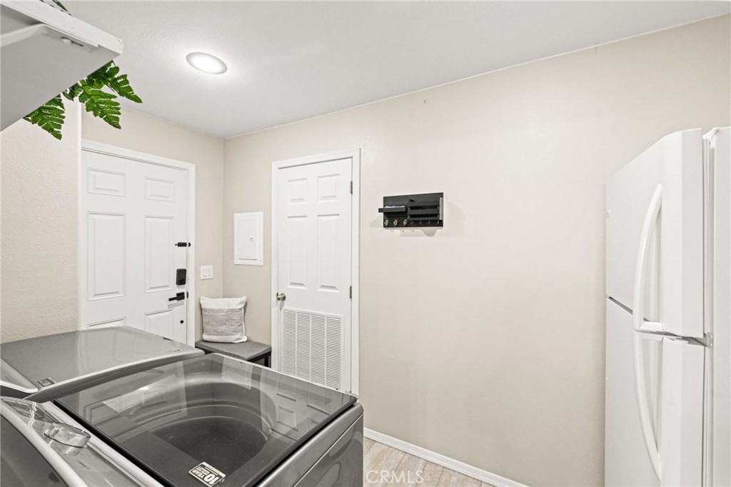 16860 Slover Avenue, Unit 70 Fontana, CA 92337 - Photo 20 of 38 a kitchen with stainless steel appliances granite countertop a refrigerator and a stove