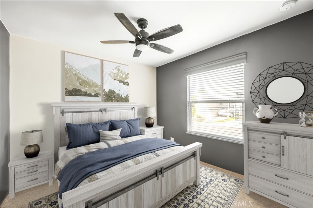 16860 Slover Avenue, Unit 70 Fontana, CA 92337 - Photo 31 of 38 a bedroom with a bed and a dresser
