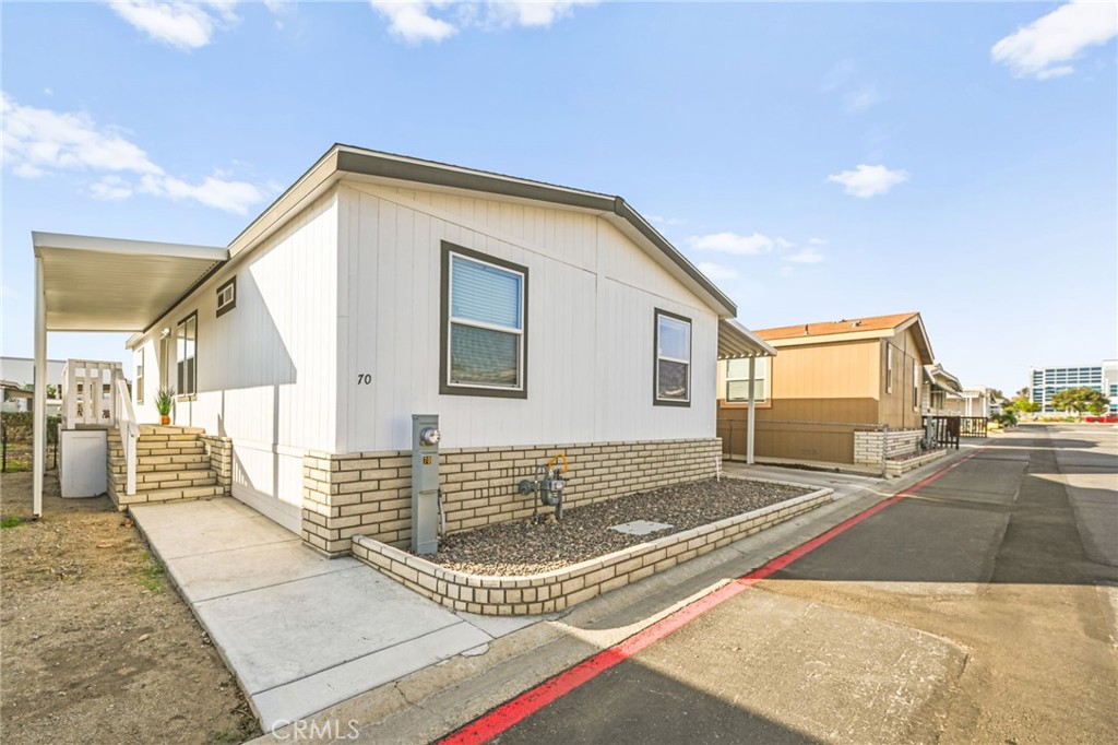 16860 Slover Avenue, Unit 70 Fontana, CA 92337 - Photo 4 of 38 a view of a house with a patio