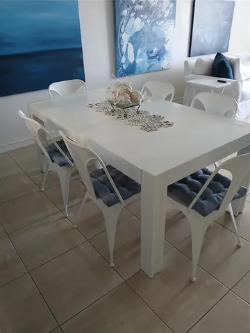 a close view of dining table and chairs
