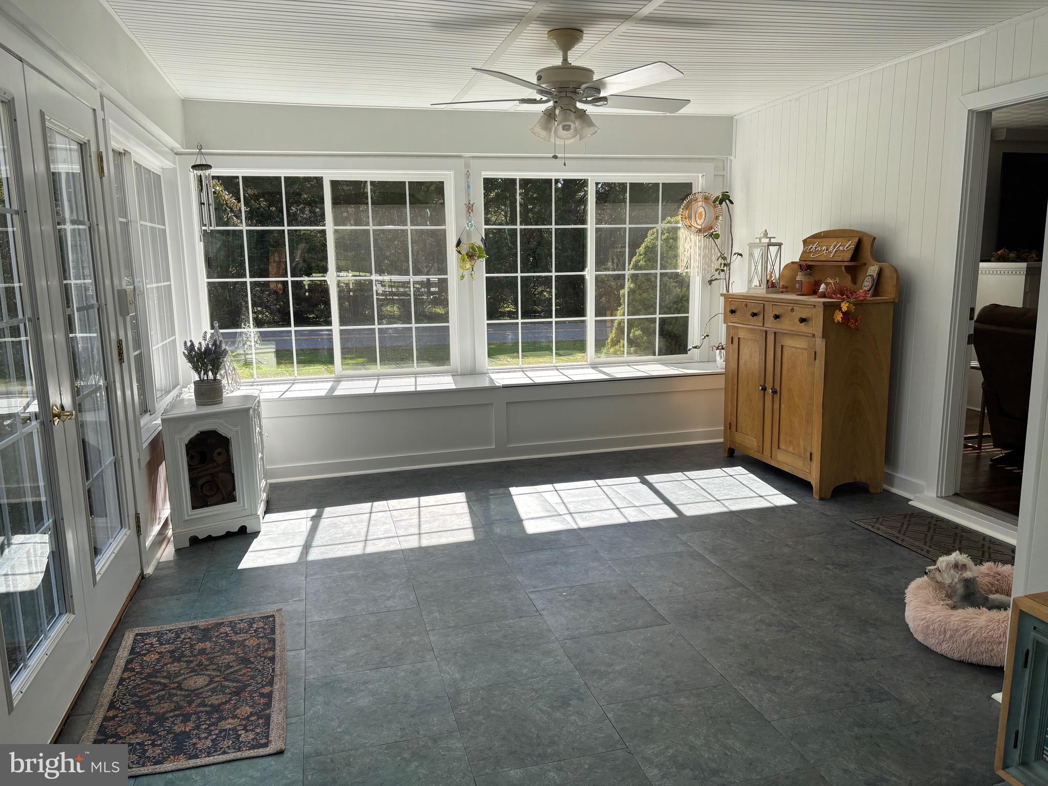 355-m F M F Bowen Road Huntingtown, MD 20639 - Photo 17 of 47 a living room with furniture and a floor to ceiling window
