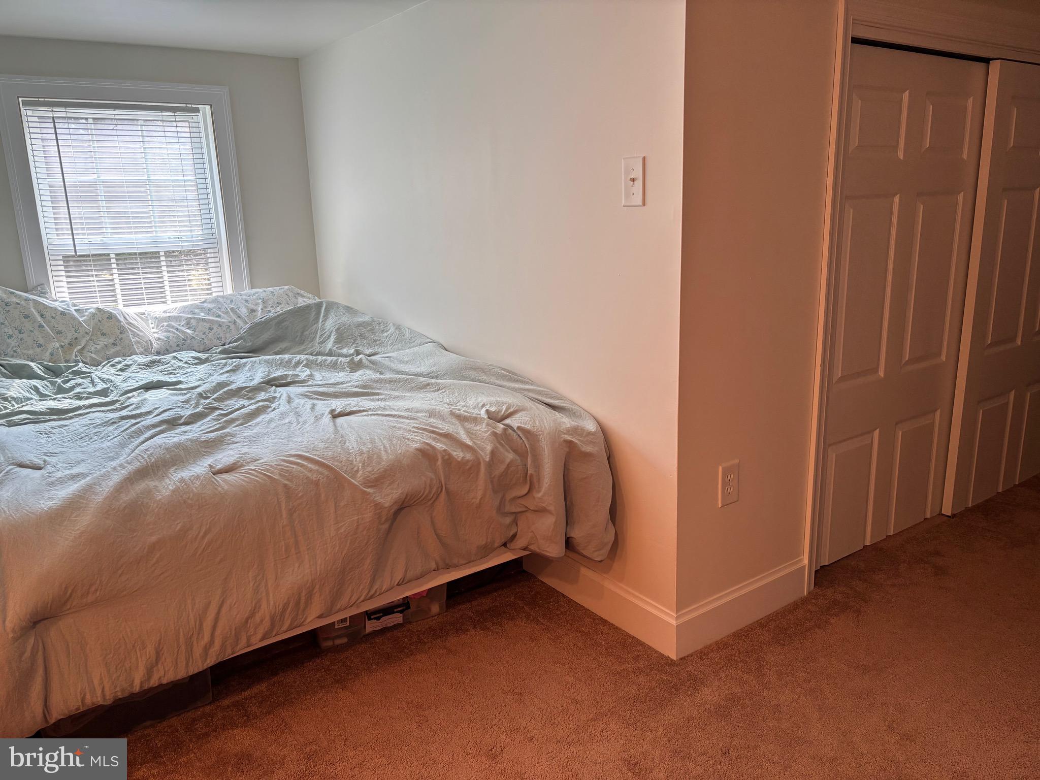 355-m F M F Bowen Road Huntingtown, MD 20639 - Photo 41 of 47 a bedroom with a bed and window