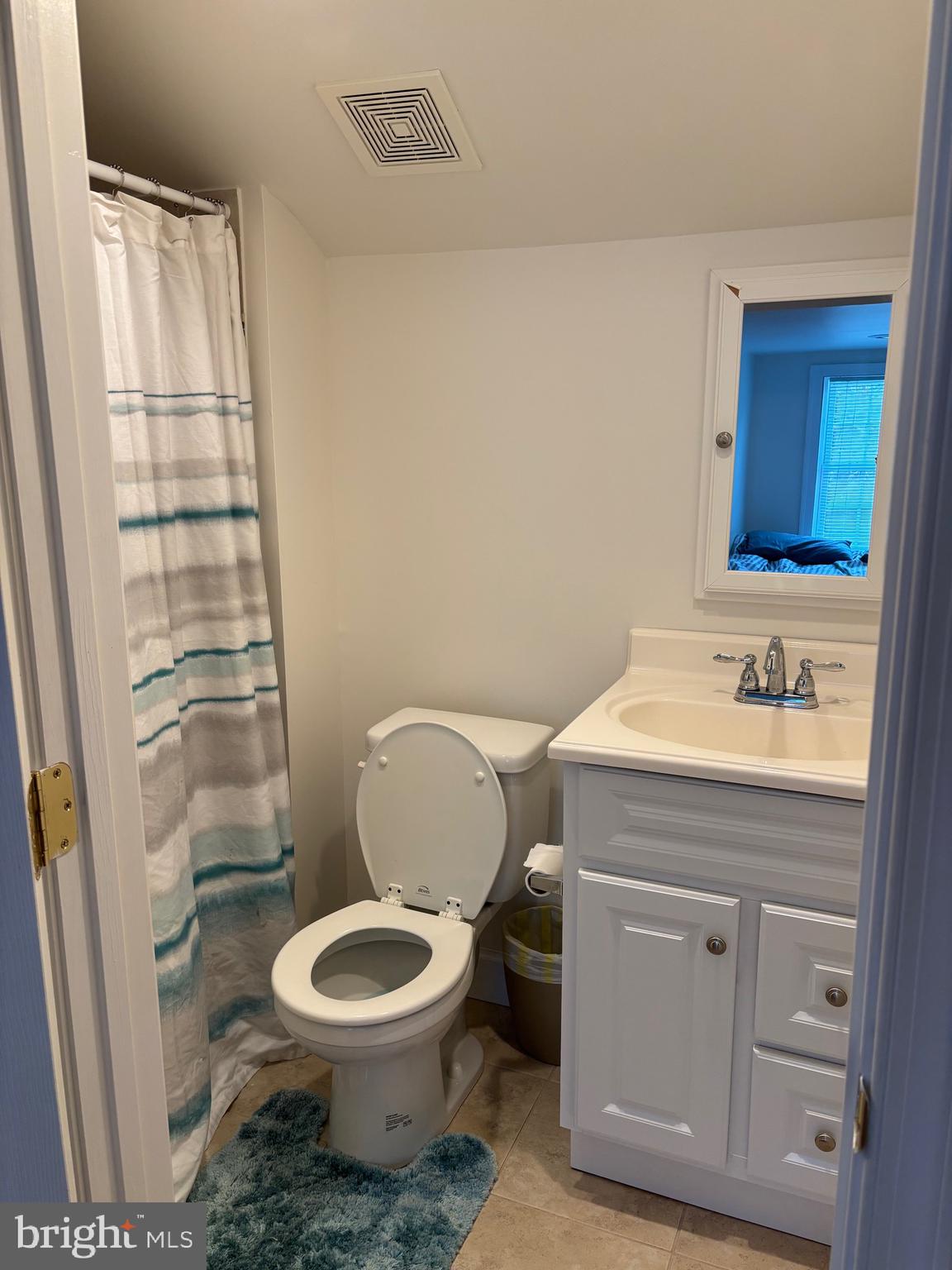 355-m F M F Bowen Road Huntingtown, MD 20639 - Photo 44 of 47 a bathroom with a granite countertop toilet sink and a mirror