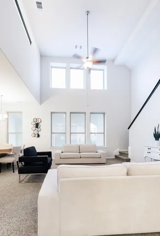 a bedroom with a bed window and flowerpot