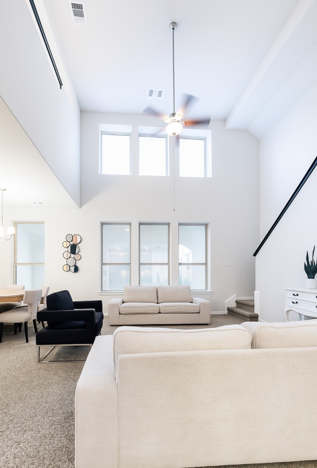 a bedroom with a bed window and flowerpot