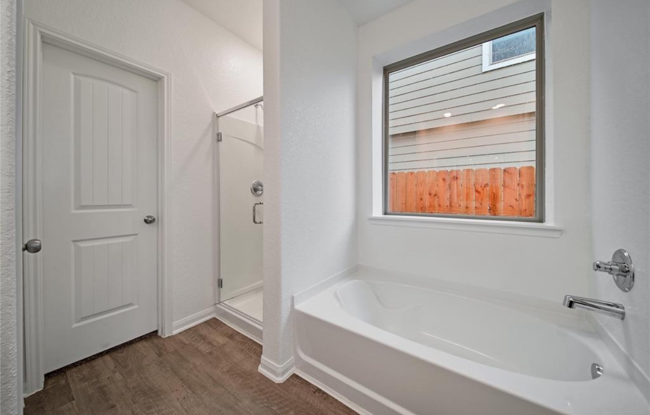 14224 Grand Hills Drive Conroe, TX 77303 - Photo 13 of 17 a white bath tub sitting next to a window