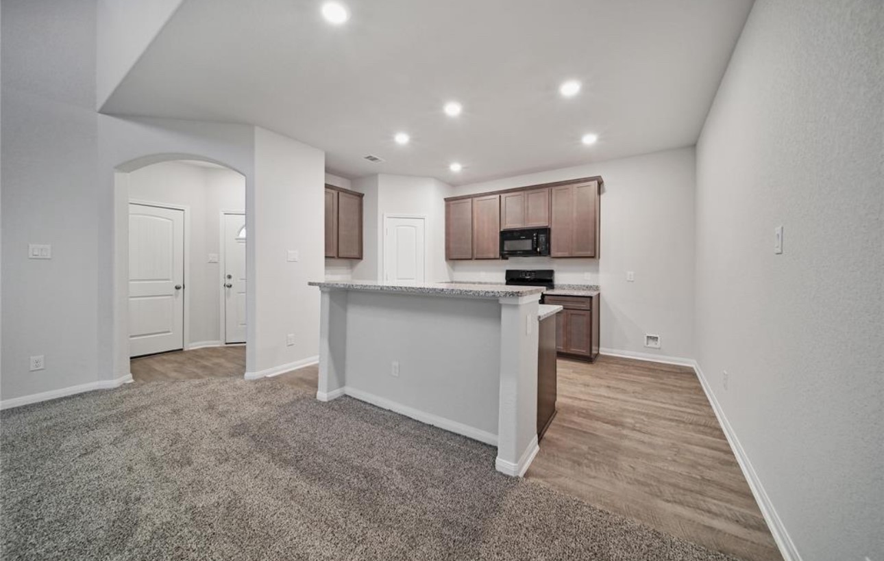 14224 Grand Hills Drive Conroe, TX 77303 - Photo 14 of 17 a view of a kitchen with electric appliances