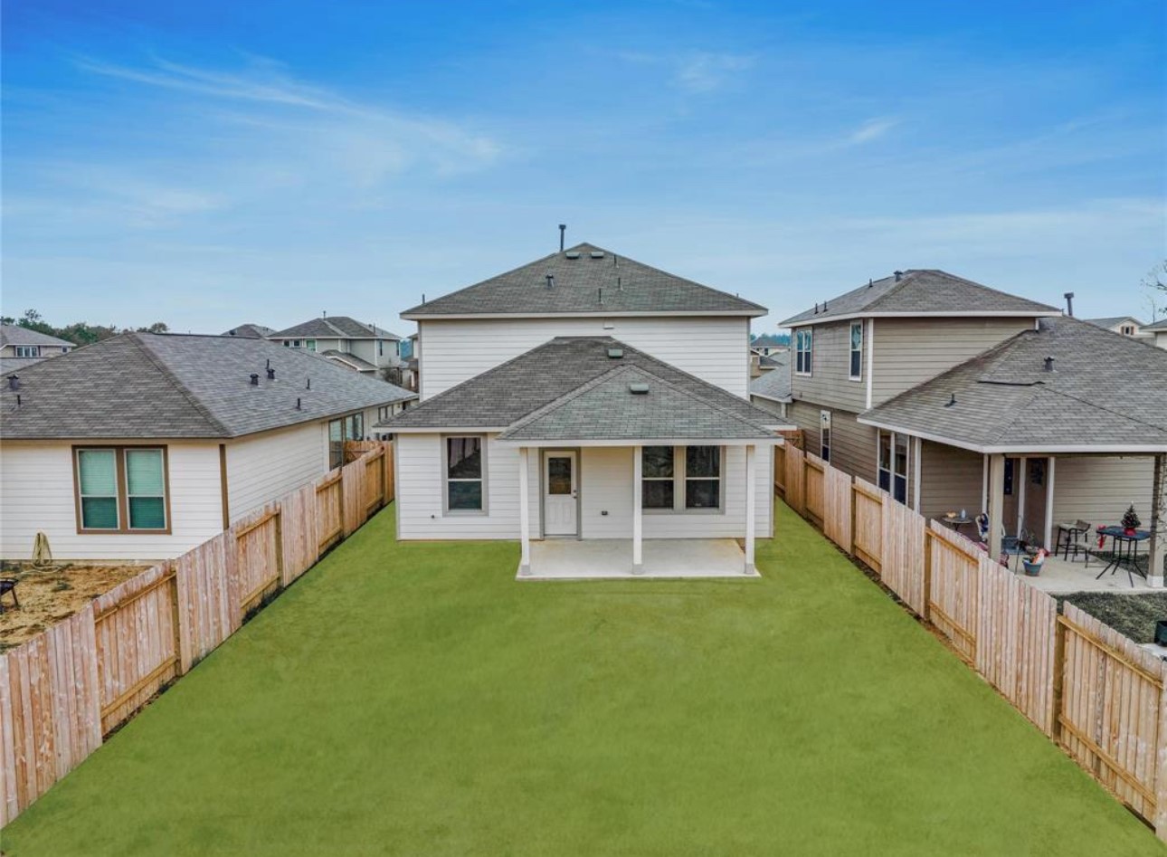 14224 Grand Hills Drive Conroe, TX 77303 - Photo 17 of 17 a front view of a house with yard