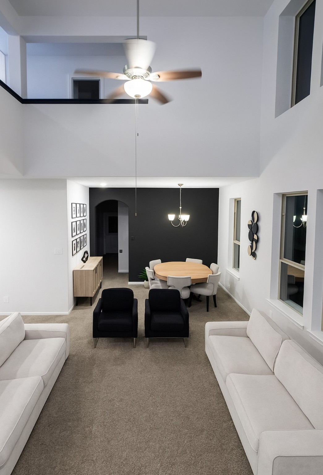 14224 Grand Hills Drive Conroe, TX 77303 - Photo 2 of 17 a living room with furniture and a chandelier