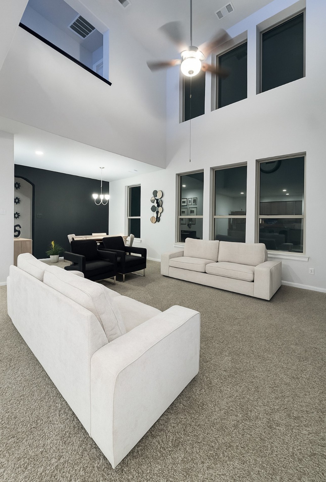 14224 Grand Hills Drive Conroe, TX 77303 - Photo 4 of 17 a living room with furniture and a flat screen tv