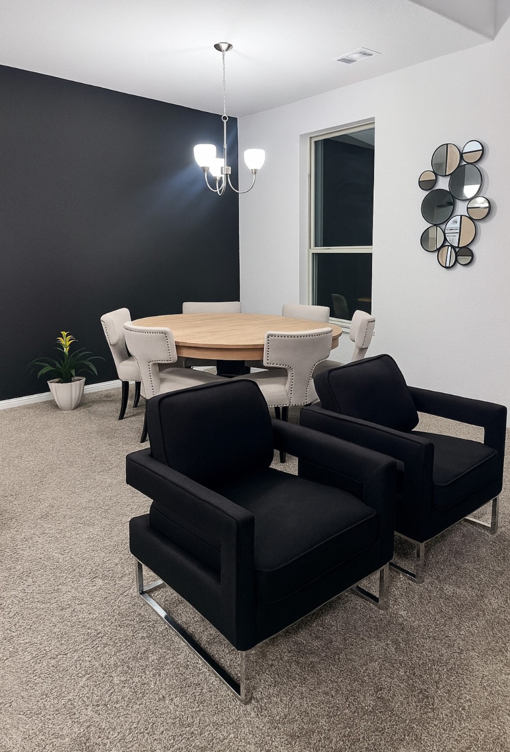 14224 Grand Hills Drive Conroe, TX 77303 - Photo 7 of 17 a living room with furniture a chandelier and a rug