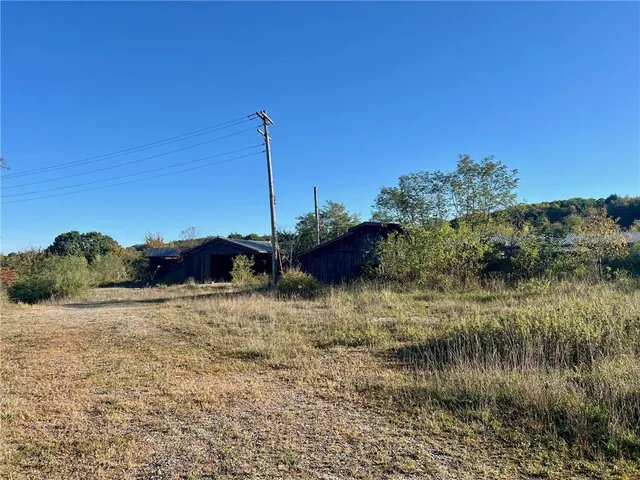 a view of a lake with a house in the background