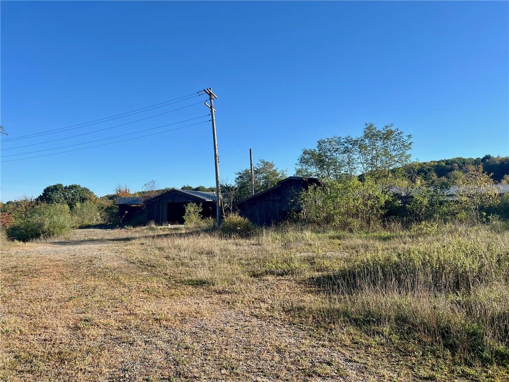 523 Farren Surrena Road Harrisville, PA 16038 - Photo 13 of 24 a view of a lake with a house in the background