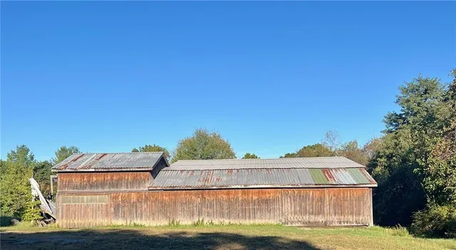 a view of a house with a yard from a balcony