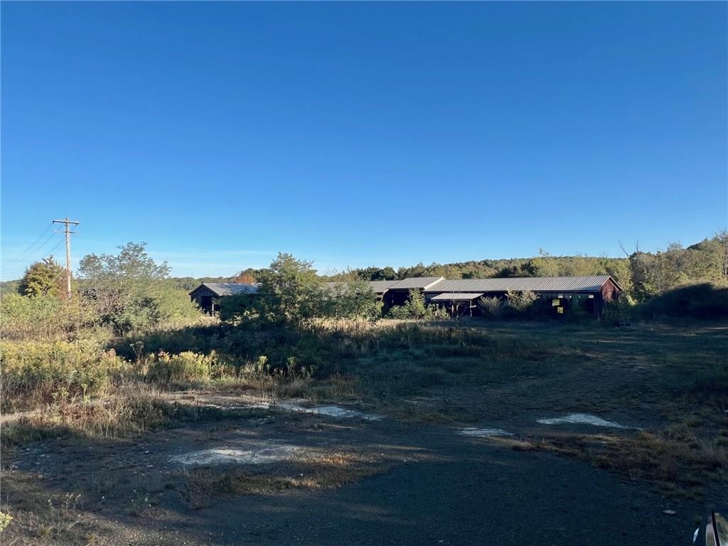 523 Farren Surrena Road Harrisville, PA 16038 - Photo 10 of 24 a car parked on the side of the road