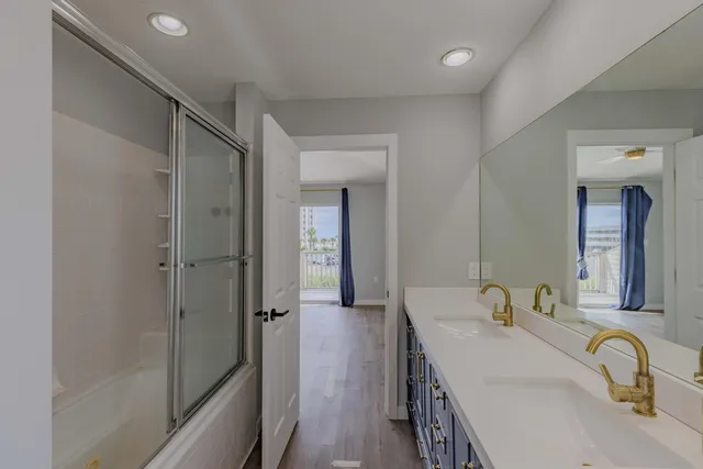 a view of a bathroom from a hallway