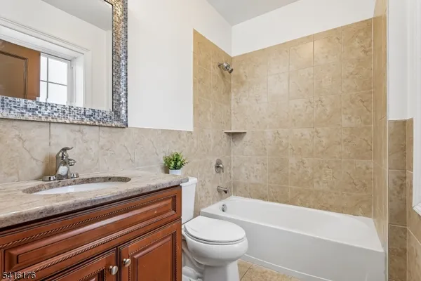 a bathroom with a sink a toilet and a bathtub