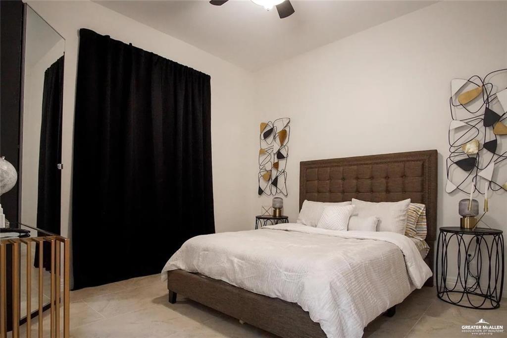 1413 Encantado Circle Palmview, TX 78572 - Photo 17 of 25 a bedroom with a bed and a dresser