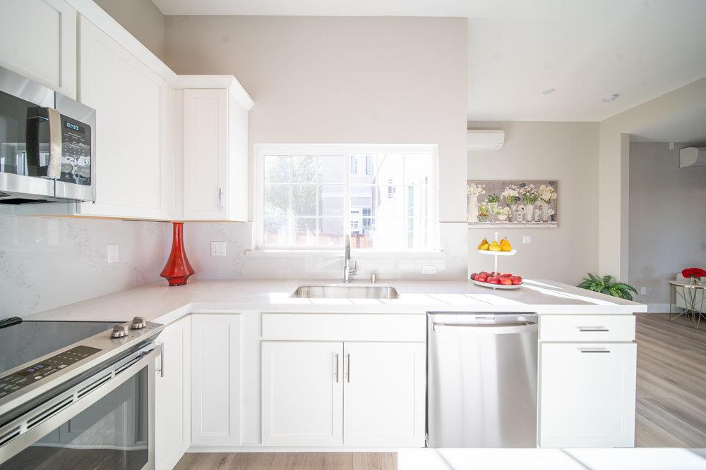 1701 Ringwood Avenue San Jose, CA 95131 - Photo 13 of 59 a kitchen with a sink stove and cabinets