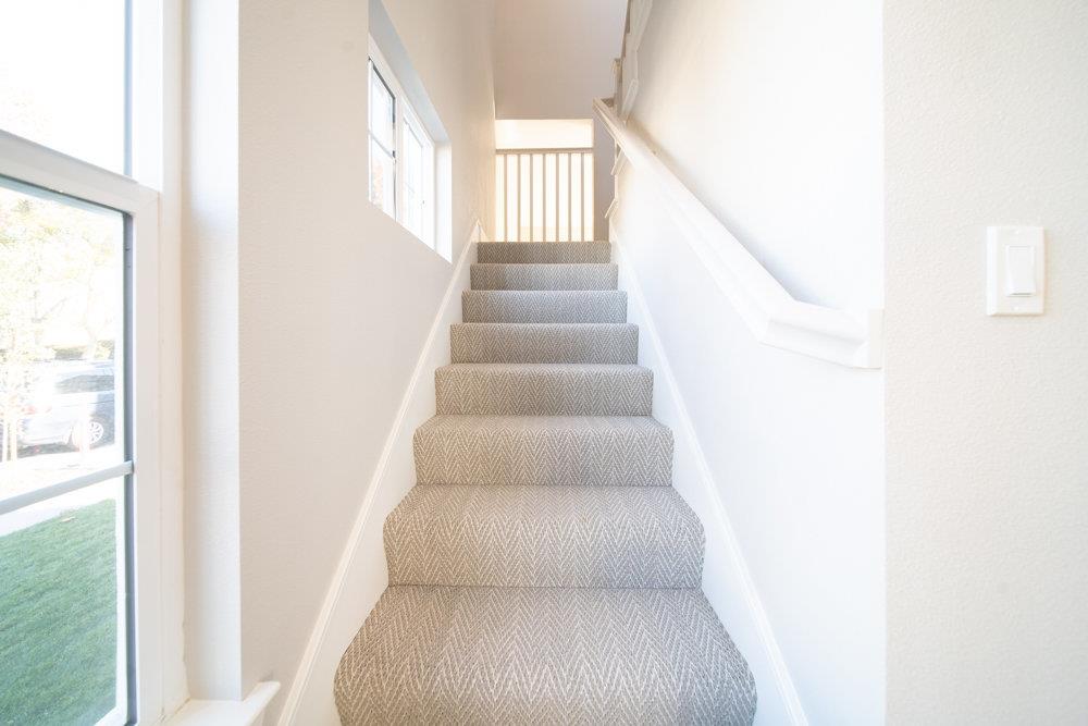 1701 Ringwood Avenue San Jose, CA 95131 - Photo 19 of 59 a view of staircase with white walls and a window