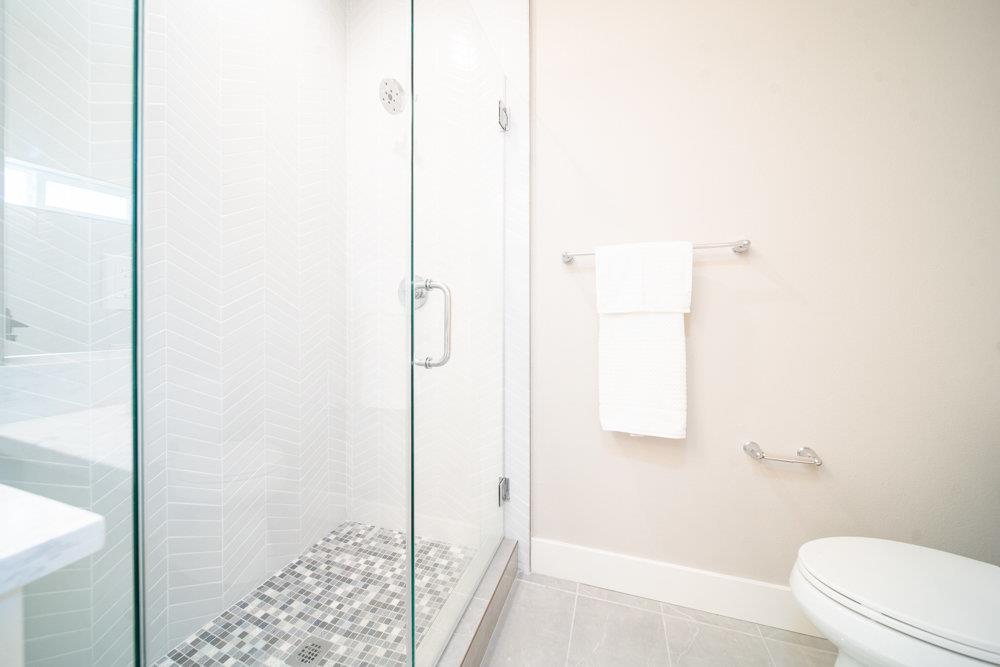 1701 Ringwood Avenue San Jose, CA 95131 - Photo 27 of 59 a bathroom with a shower and a toilet