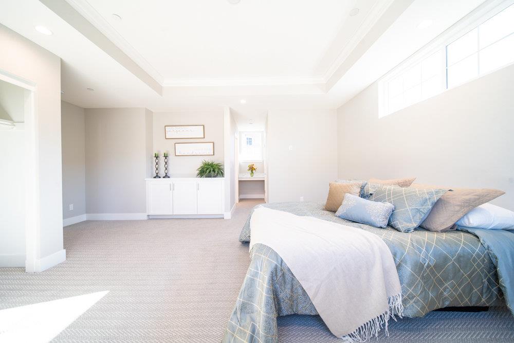 1701 Ringwood Avenue San Jose, CA 95131 - Photo 31 of 59 a bedroom with a bed and a couch