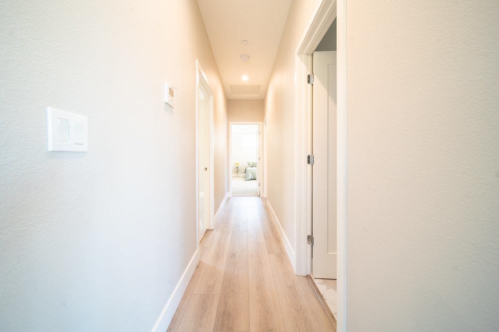 1701 Ringwood Avenue San Jose, CA 95131 - Photo 45 of 59 a view of a hallway with wooden floor
