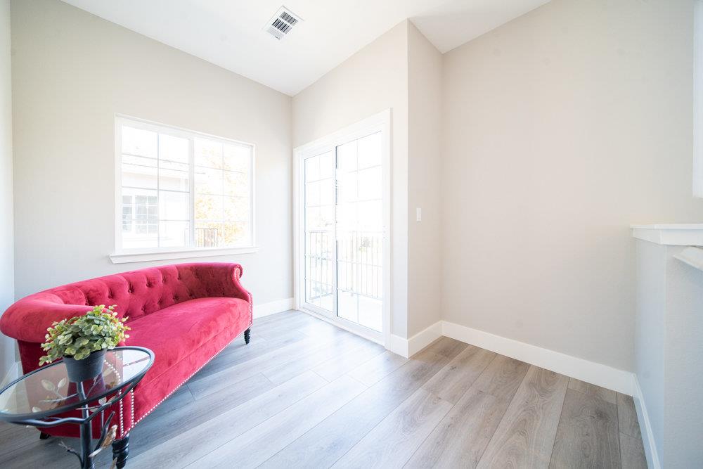 1701 Ringwood Avenue San Jose, CA 95131 - Photo 50 of 59 a living room with furniture and a potted plant