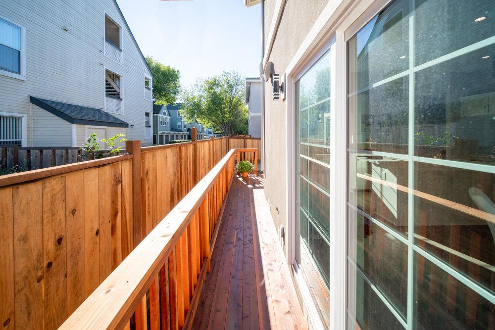 1701 Ringwood Avenue San Jose, CA 95131 - Photo 51 of 59 a view of balcony with wooden floor and fence