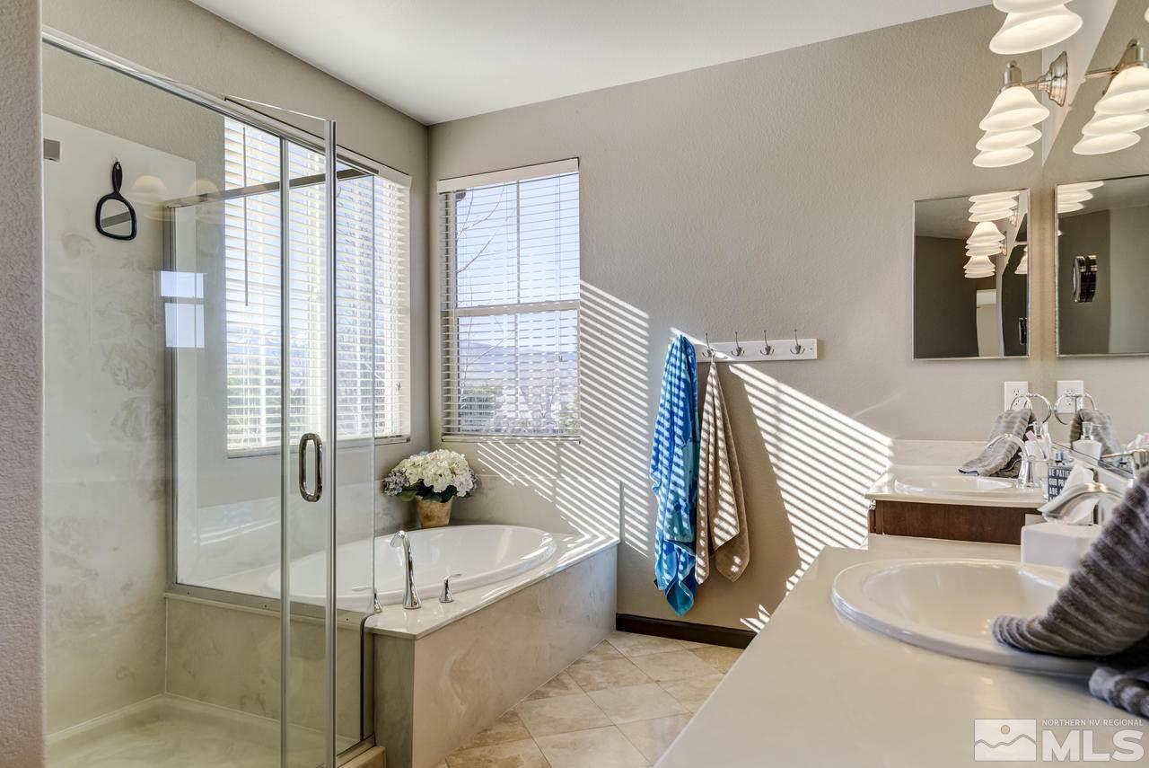 460 Ruffian Court Reno, NV 89521 - Photo 15 of 25 a bedroom with a bed and a window