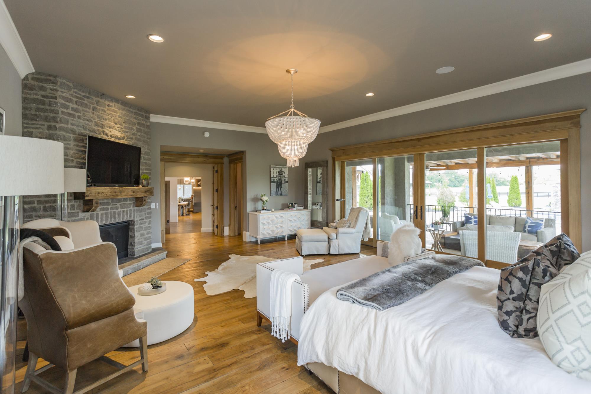 3672 Talley Moore Road Columbia, TN 38401 - Photo 11 of 30 Master bedroom offers views of Flat Creek along with views of the pool and a private patio with daybed and gas fire pit.