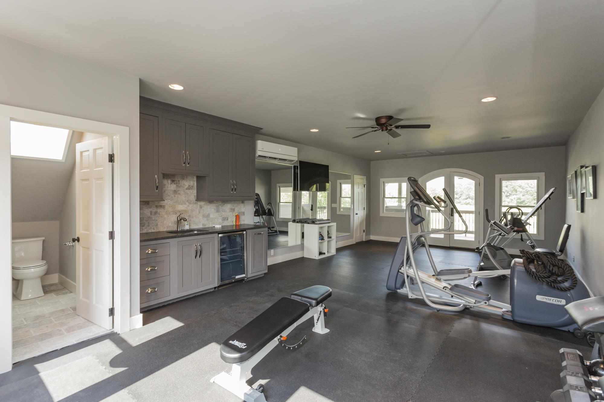 3672 Talley Moore Road Columbia, TN 38401 - Photo 18 of 30 Flex space above garage currently being used as a workout space. Has full bath along with sink and small refrigerator.