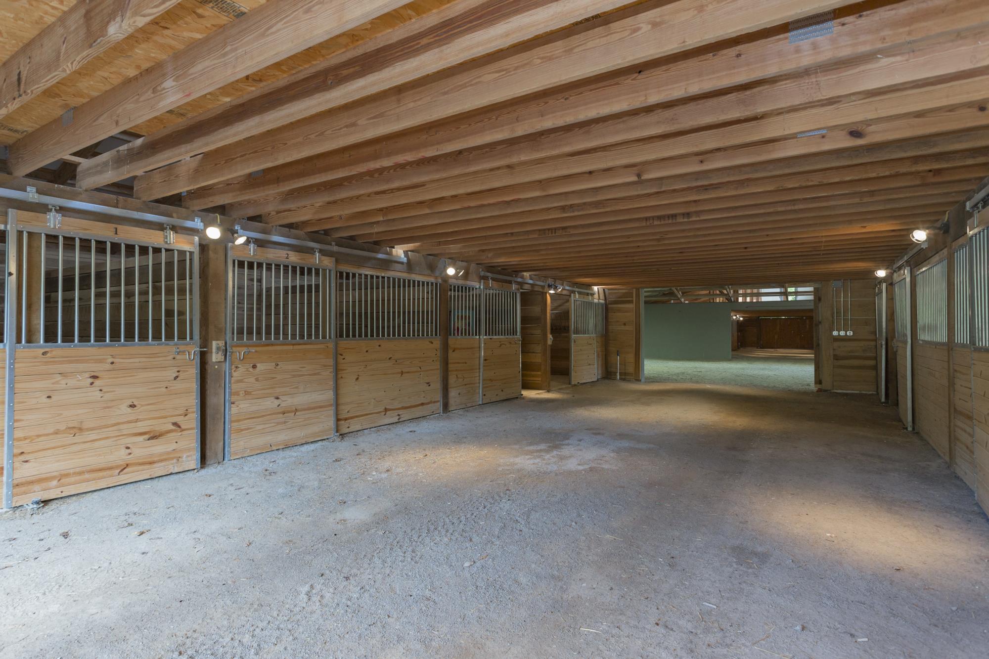 3672 Talley Moore Road Columbia, TN 38401 - Photo 29 of 30 10,000 square foot horse barn with 10 stalls (room for more), full bath and tack rooms! Space could be used for many different things.