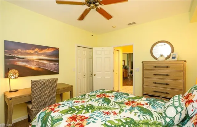 a bedroom with a bed and cabinets