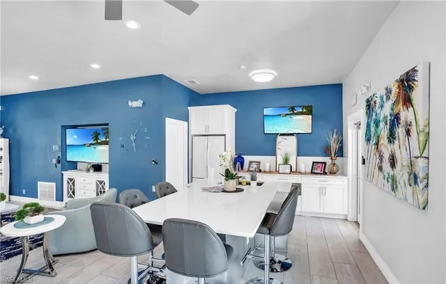 a dining room with furniture and wooden floor