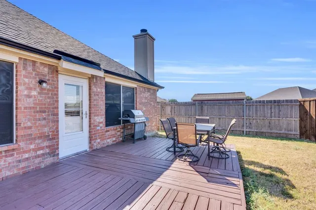 a hallway with a door and a bathroom