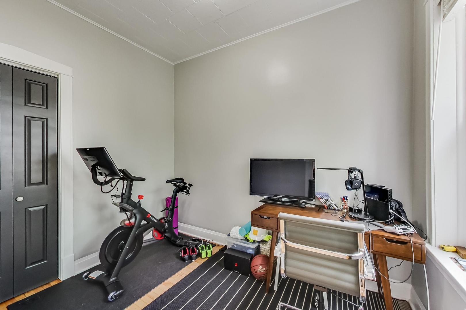 2145 West Thomas Street, Unit 3 Chicago, IL 60622 - Photo 11 of 17 a view of a room with gym equipment