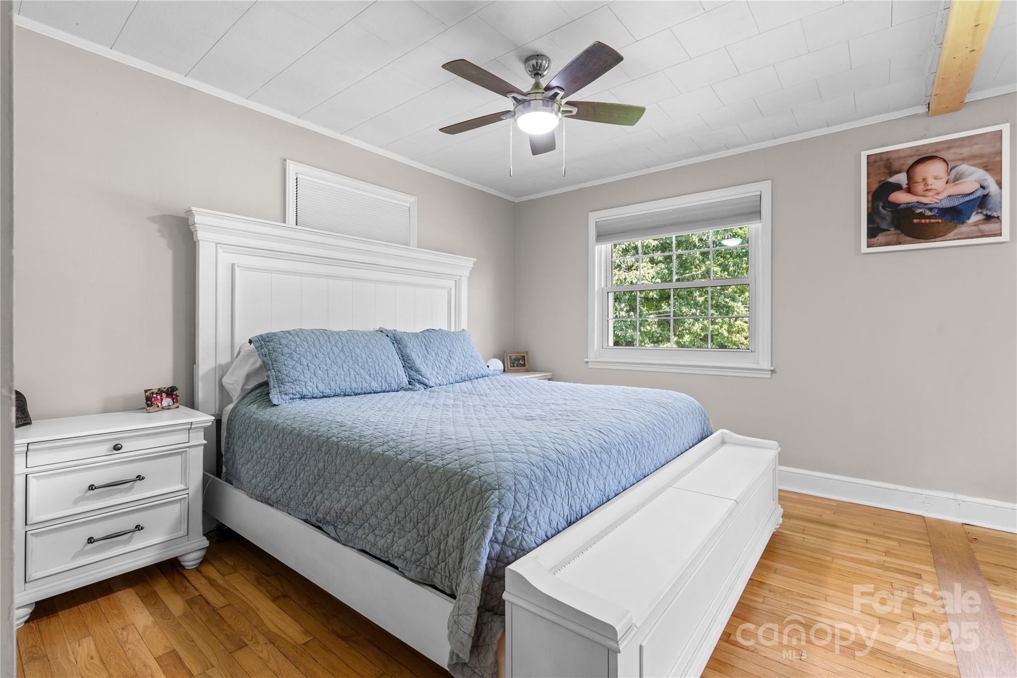 1838 Connelly Springs Road Lenoir, NC 28645 - Photo 12 of 24 a bedroom with a bed and a window