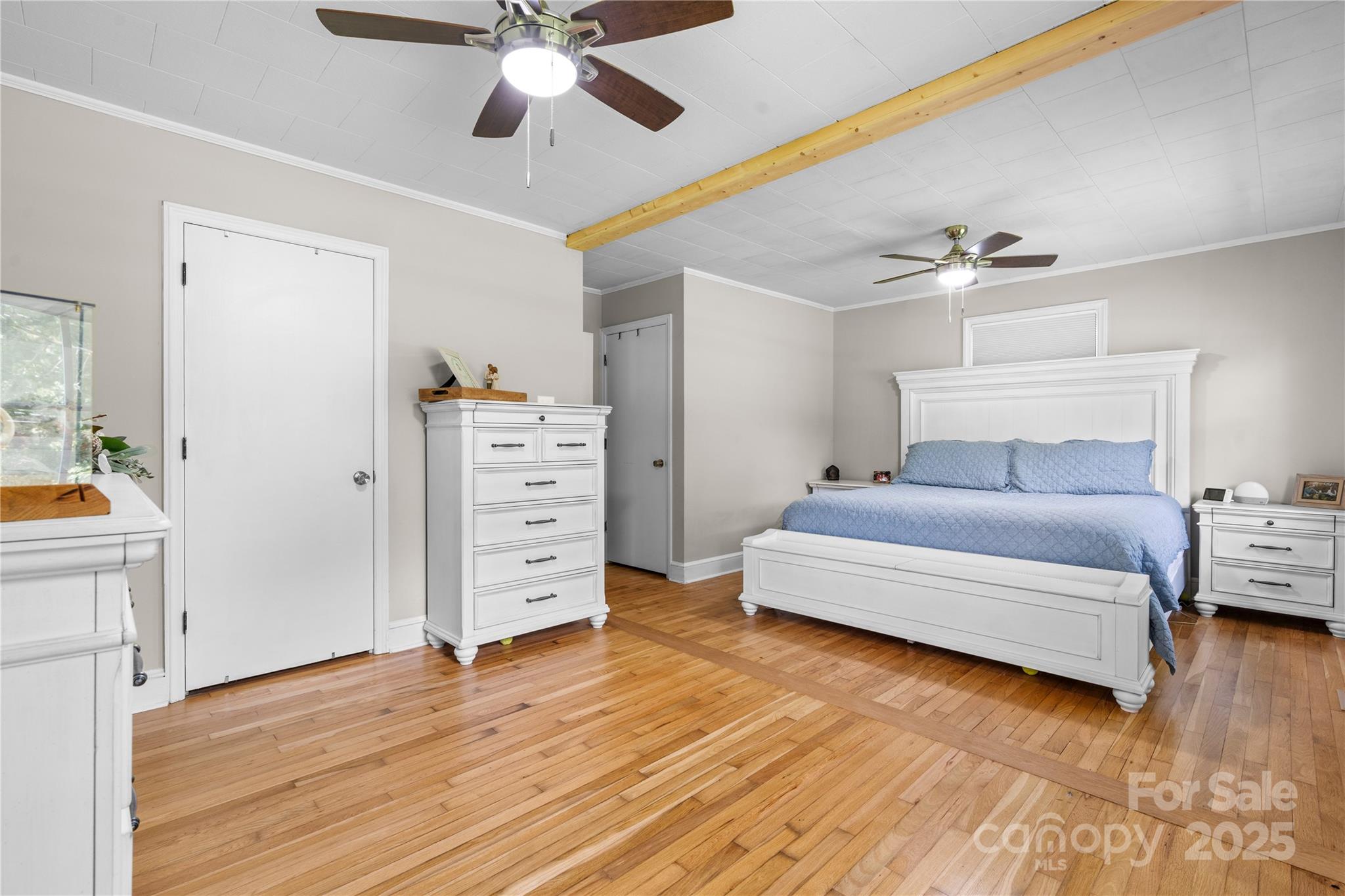 1838 Connelly Springs Road Lenoir, NC 28645 - Photo 14 of 24 a spacious bedroom with a bed and wooden floor