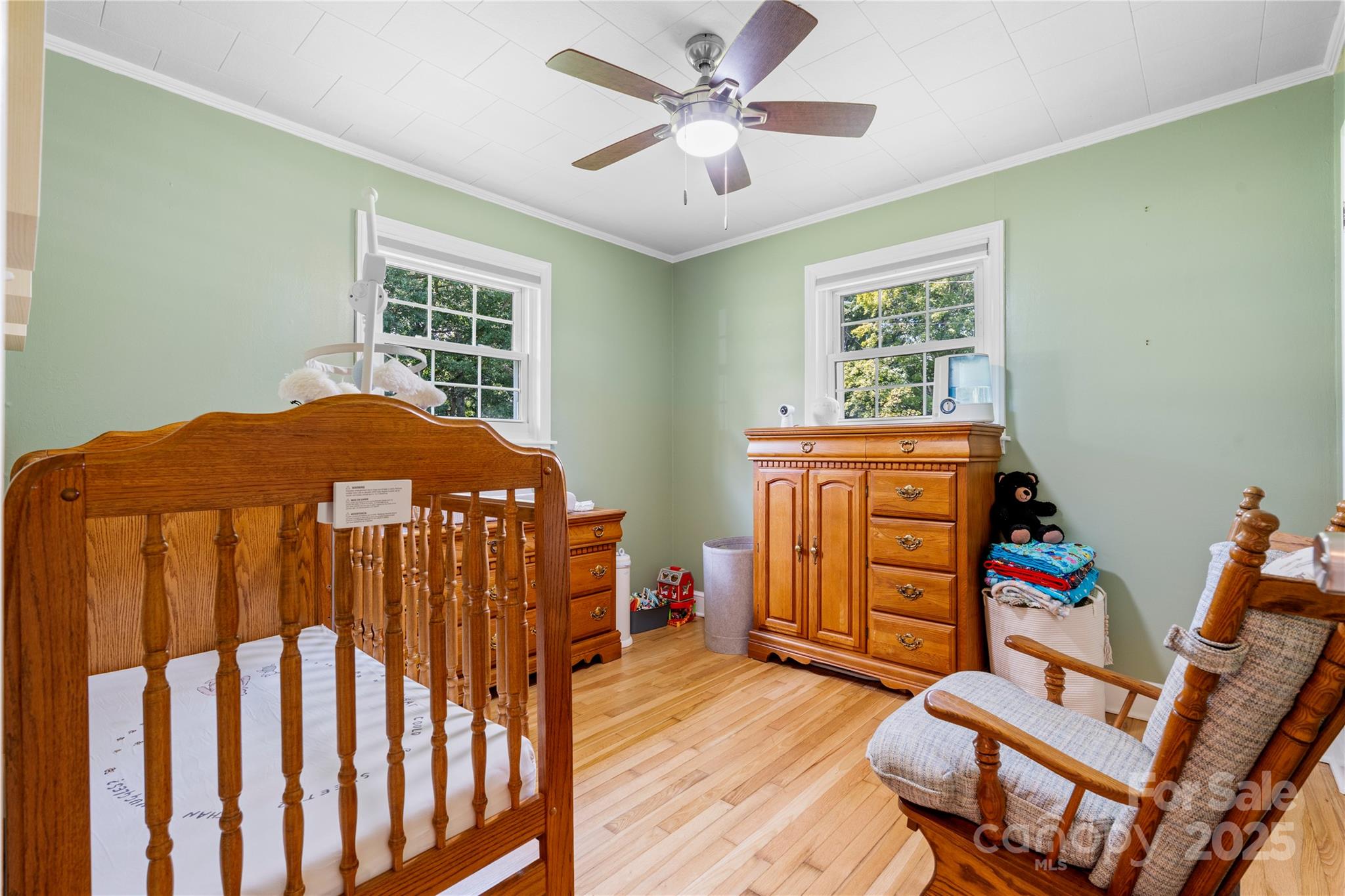 1838 Connelly Springs Road Lenoir, NC 28645 - Photo 16 of 24 a bedroom with a bed and wooden floor