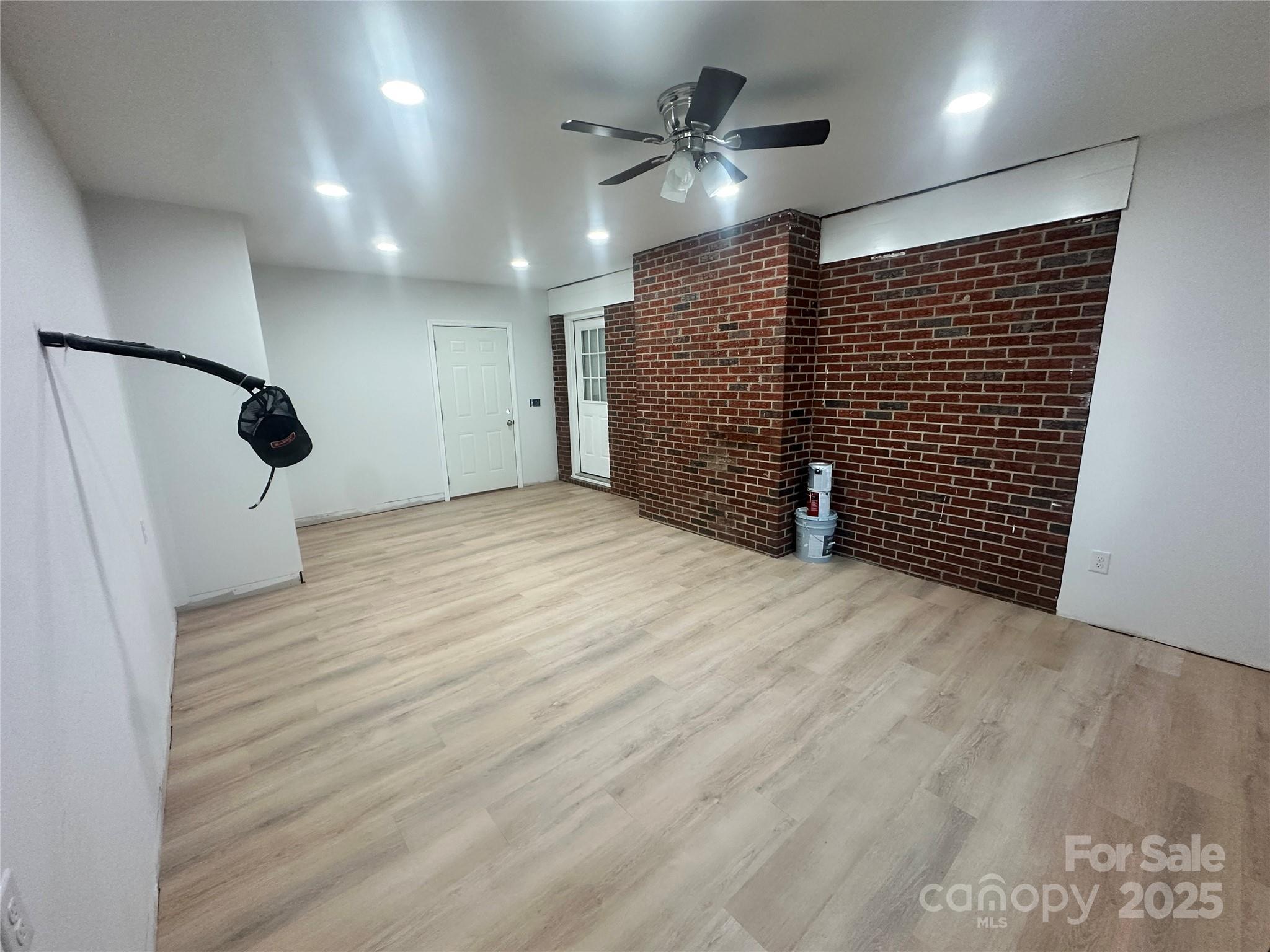 1838 Connelly Springs Road Lenoir, NC 28645 - Photo 17 of 24 a view of an empty room with wooden floor