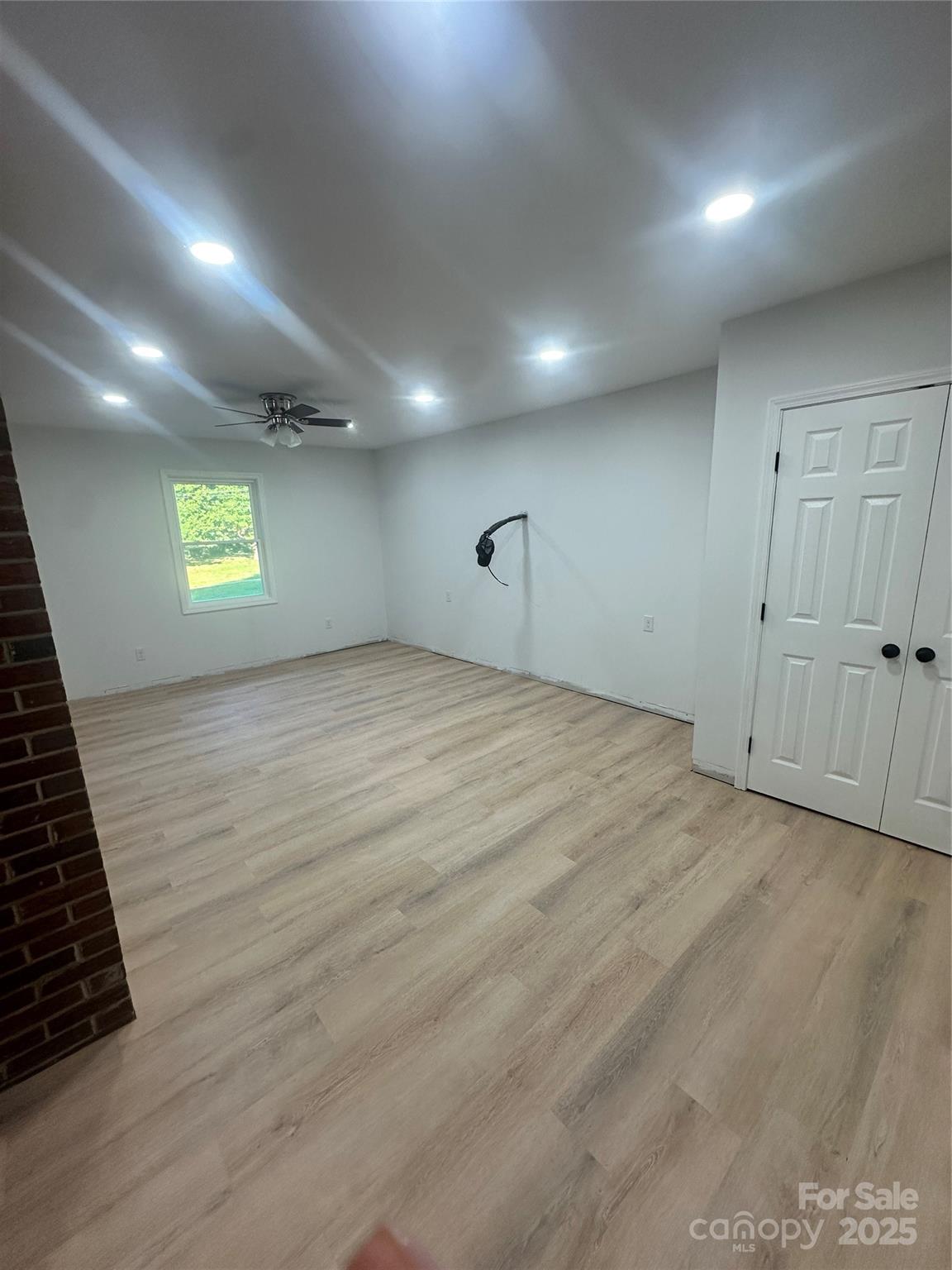 1838 Connelly Springs Road Lenoir, NC 28645 - Photo 18 of 24 an empty room with windows and cabinet