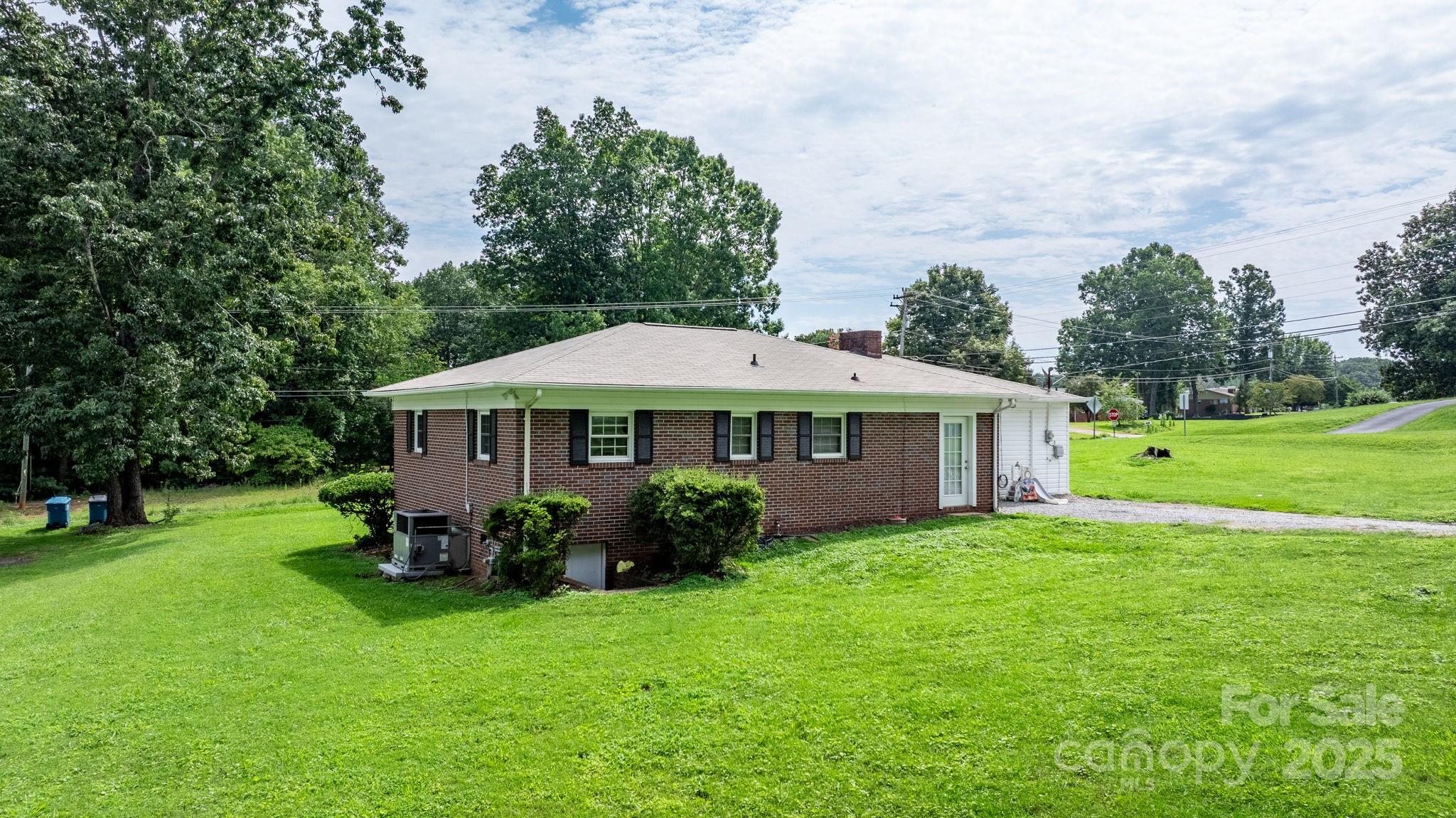 1838 Connelly Springs Road Lenoir, NC 28645 - Photo 19 of 24 a view of a house with a yard