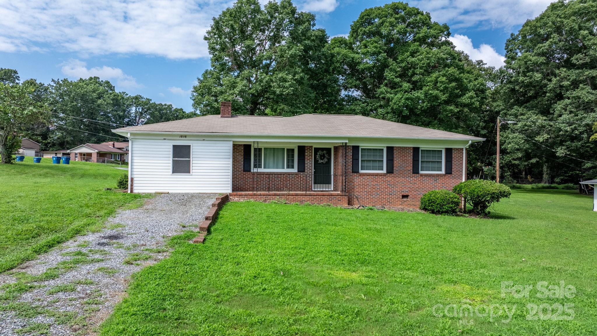 1838 Connelly Springs Road Lenoir, NC 28645 - Photo 3 of 24 a front view of a house with a yard