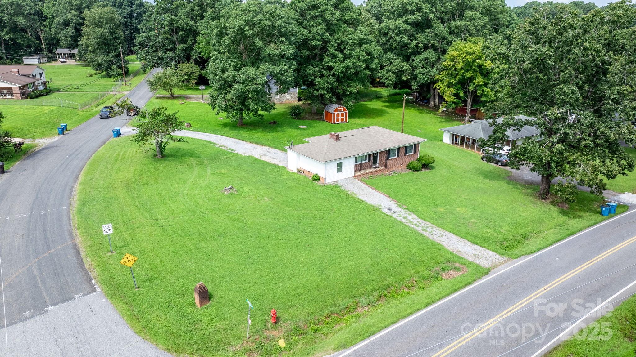 1838 Connelly Springs Road Lenoir, NC 28645 - Photo 5 of 24 a view of a golf course with a garden